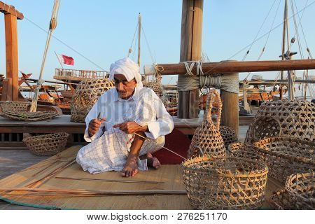 Doha - Qatar / November 2017: Kuwaiti Craftsman Making Traditional Fishing Baskets During The Dhow F