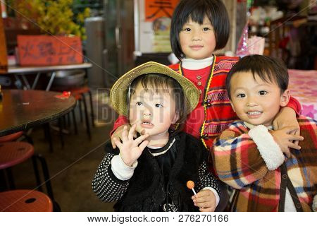 Taiwan, Cingjing - May 2013 : An Unidentified Taiwanese Indigenous Siblings Pose In Front My The Cam