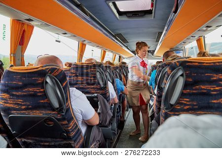 Marmaris, Turkey - May 26, 2018: Female Guide In The Bus With Tourists. People During Travel. Transf