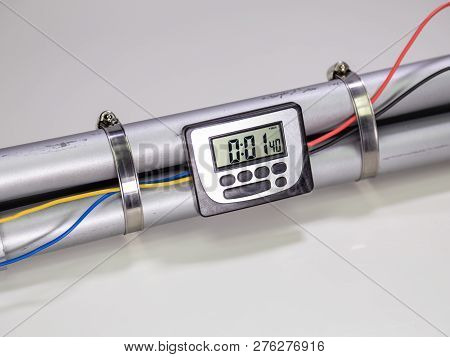 Pipe Bomb With An Clock Timer To Trigger Detonation On White Background