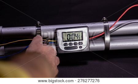 Hand Cutting Wire On Pipe Bomb