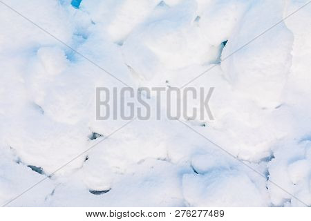 Snow And Ice Crystal Background Or Texture Of Russian Park Of Forest. The White Snow Surface Of The 