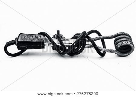 Close Up Of Black Handled Immersion Rod Or Immersion Water Heater Isolated On White.