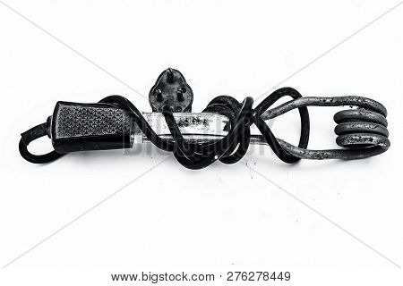 Close Up Of Black Handled Immersion Rod Or Immersion Water Heater Isolated On White.
