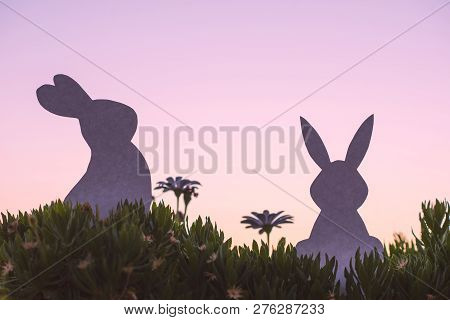 Creative  Photo Of Two Silhouette Paper Rabbits In The Chamomile Flowers And Green Grass On The Suns