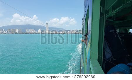 Penang - Malaysia / September 2016: Passengers Looking Through The Ferry Window During The Move Betw