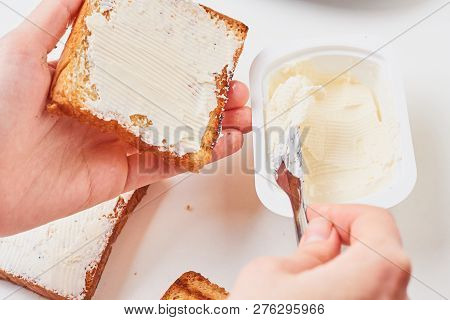 Woman Hand Make Sandwich, Spred Toasted Bread With Cheese