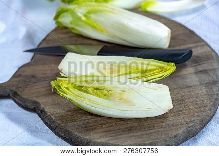 Group Of Fresh Raw Green Belgian Endive Or Hicory Vegetables, Also Known As Witlof Salade Close Up