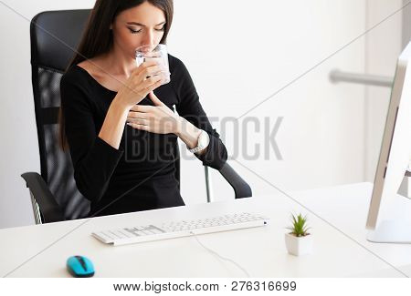 Heart Pain. Woman Having Panic Attack At Workplace