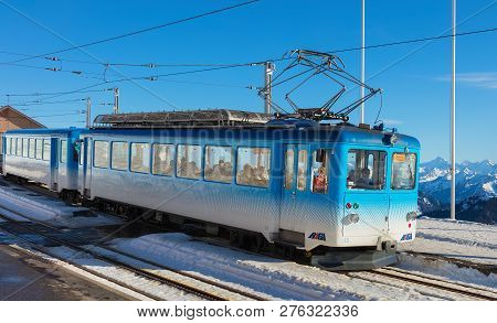 Mt. Rigi, Switzerland - January 25, 2016: A Passenger Train Of The Rigi Railways At The Station On T