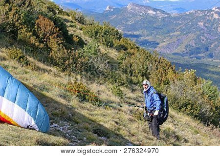 Paraglider Preparing To Launch His Wing On The Chabre Mountain
