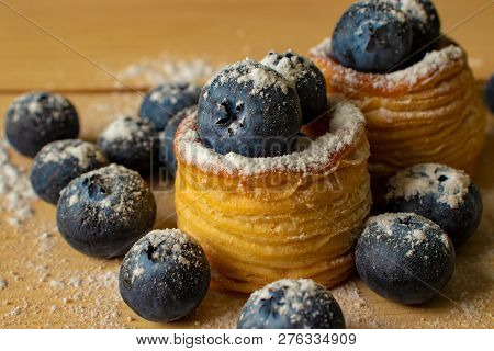 Blueberries With Dough Baskets Covered With Powdered Sugar
