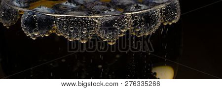 Blueberries In Soft Drinks With Bubbles Closeup