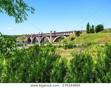 Arch Bridge Of Preobrazhensky Across The New Dnieper To Khortytsia Island In Zaporizhia. Beautiful F