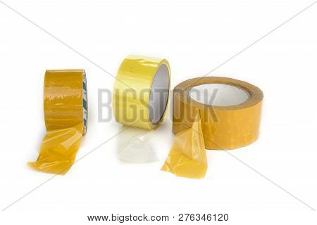 Three Rolls Of Scotch Tape On A White