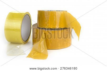 Three Rolls Of Scotch Tape On A White