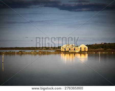 Shot Of A Ruined Building In The Center Of A Stretch Of Water In Vendicari
