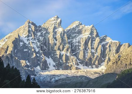 Sunrise On A Snow-capped Mountain Peak. A Mountain With A Glacier In Sonmarg Kashmir