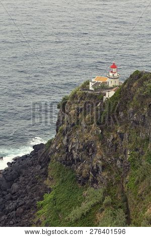Closeup View Of Faro Do Arnel Lighthouse From Above.