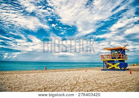 Lifeguard Tower For Rescue Baywatch On South Beach In Miami, Usa. Red And Blue Wooden House On Sea S