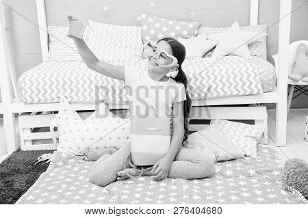 Subscribe Her Vlog. Vlogger Streaming Video. Girl Child Sit On Bed In Her Bedroom And Taking Selfie 