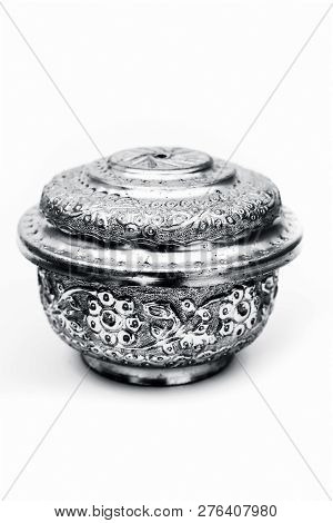 Close Up Of White Or Silver Colored Shiny Container Isolated On White.
