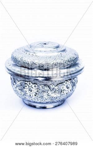 Close Up Of White Or Silver Colored Shiny Container Isolated On White.