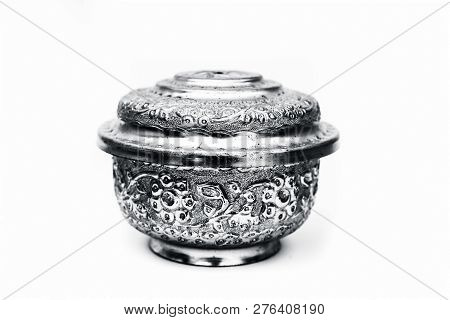 Close Up Of White Or Silver Colored Shiny Container Isolated On White.