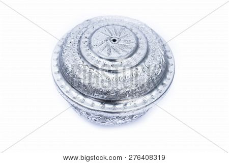 Close Up Of White Or Silver Colored Shiny Container Isolated On White.