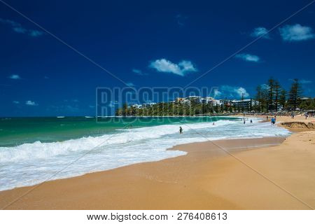 CALOUNDRA, AUS - DEC 28 2018: Hot sunny summer day at Moffat Beach, Calundra, Queensland, Australia