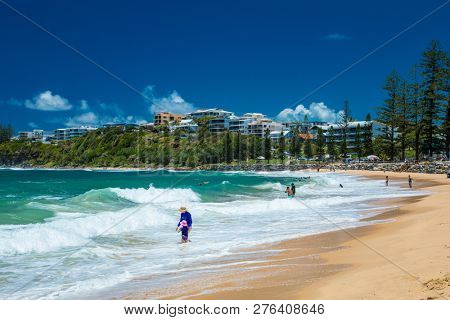 CALOUNDRA, AUS - DEC 28 2018: Hot sunny summer day at Moffat Beach, Calundra, Queensland, Australia