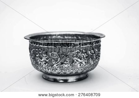 Close Up Of White Or Silver Colored Shiny Container Isolated On White.
