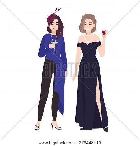 Pair Of Girls In Stylish Evening Outfits Standing Together And Drinking Cocktails. Pretty Young Wome
