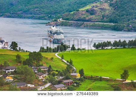 Flam, Norway - July 31, 2018: Norwegian Fjord Village With Sognefjord Landscape And Cruise Ship