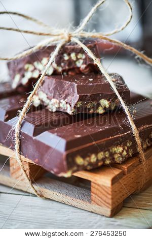 Cllose-up Of Typical Spanish Christmas Chocolate Turron Or Nougat Dessert. New Year And Holidays Sea