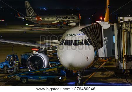 Passenger Airplane At The Night Airport