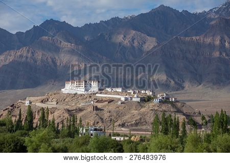 Stakna gompa temple ( buddhist monastery ) with a view of Himalaya mountains in Leh, Ladakh, Jammu and Kashmir, India.