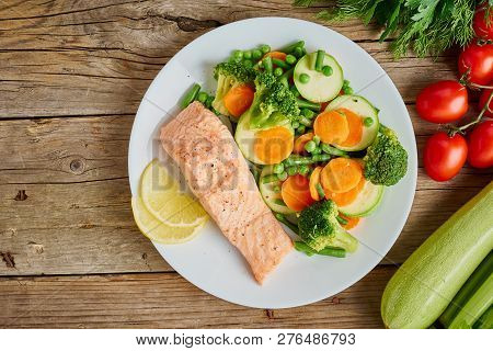 Steam Salmon And Vegetables, Paleo, Keto, Fodmap Diet. White Plate On Old Rustic Wooden Table, Top V