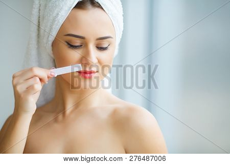 Hair Removal Wax. Young Woman Reciving Facial Epilation