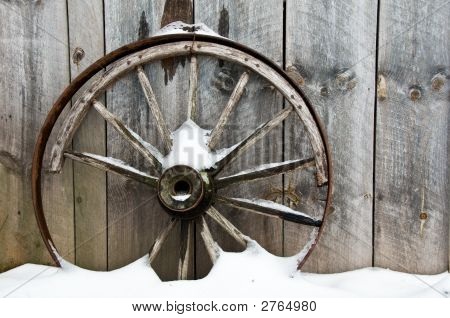 Background Old Rusty Wheel And Board Wall