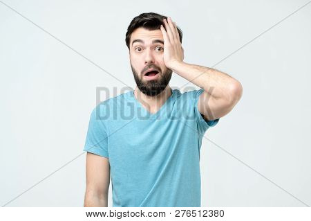 Puzzled Frustrated Male Looks With Bewilderment, Reacts On Sudden Message