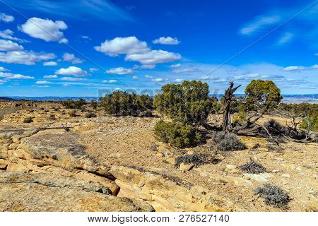View From Summit Of Mcinnis Canyons In Utah With Blue Sky And Clouds.