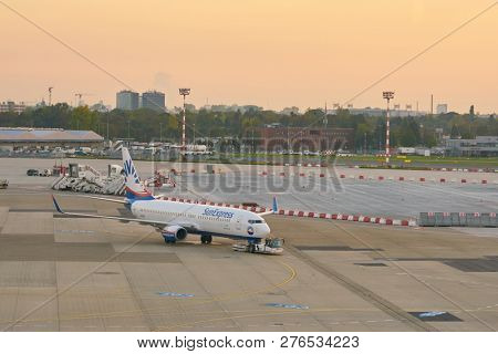 DUSSELDORF, GERMANY - CIRCA OCTOBER, 2018: SunExpress aircraft on pushback at Dusseldorf Airport.