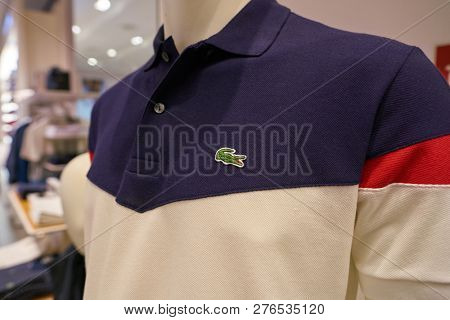 DUSSELDORF, GERMANY - CIRCA SEPTEMBER, 2018: Lacoste sign on apparel at Lacoste shop in Dusseldorf.