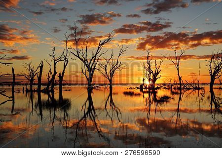 Sunset And Mirrored Reflections On Lake Menindee A Large Shallow Lake In Central Australia