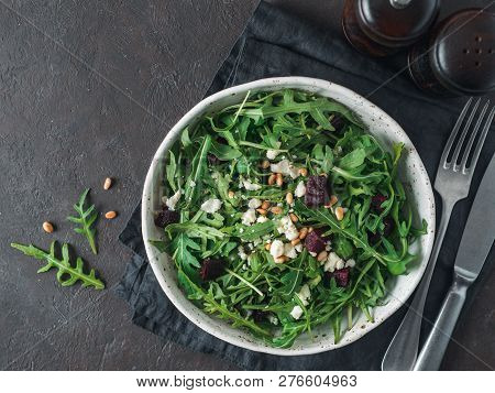 Beetroot, Aragula And Soft Cheese Salad Over Black Background. Top View Or Flat Lay. Copy Space For 