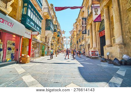 Valletta, Malta - June 18, 2018: Walk The Famous Republic Street - The Central City Promenade With F