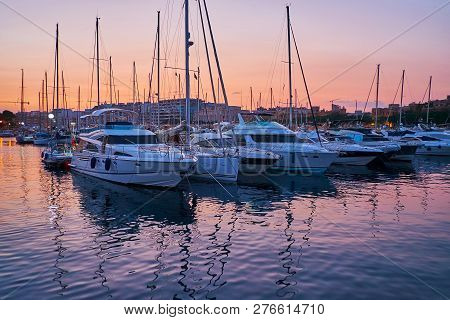 Enjoy The Evening At Msida Yacht Marina, Modern Vessels Reflect In Dark Clear Waters, Malta.