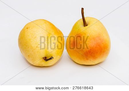 Two Organic Pears On The White Background