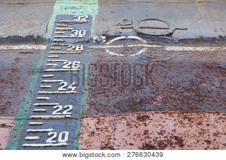 Load Line Marking And Draft Scale On The Rusty Hull Of The Ship In Dry Docking During Repairs
